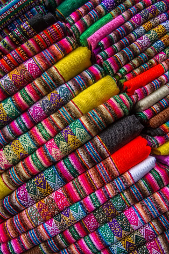 Colorful traditional woven fabrics displaying intricate patterns and vibrant colors.